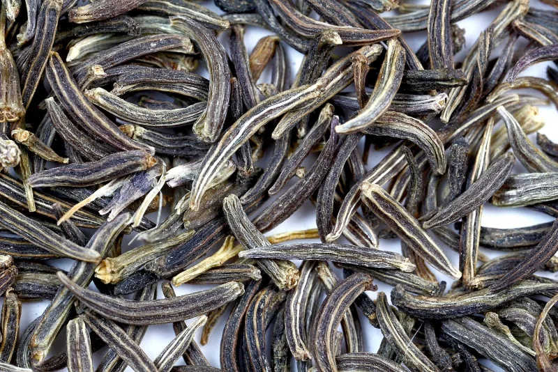 Whole aromatic cumin seeds photographed up close