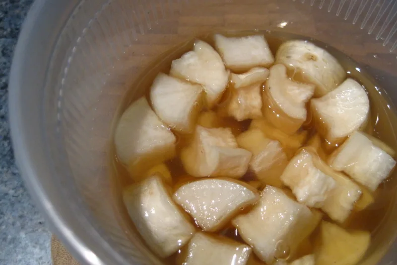 Homemade natural cough syrup in a glass jar, with honey and lemon